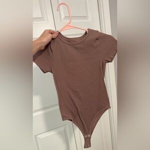 BROWN BODYSUIT. size xs/s. NEVER worn.